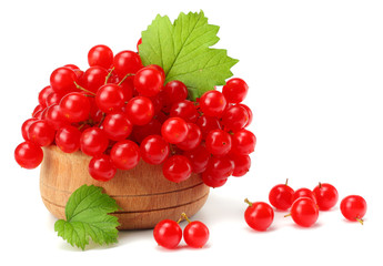 Red berries of Viburnum (arrow wood) in wooden bowl with green leaf isolated on white background top view