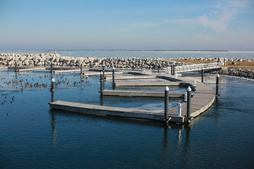 Fototapeta premium empty pier on the lake in winter