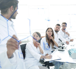 view through the transparent Board. a scientist makes a report.