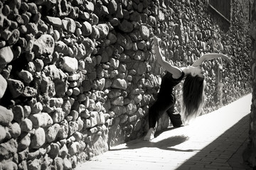 Contemporary dancer posing on the street in black and white - Powered by Adobe