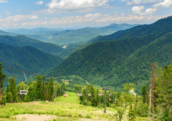 Fototapeta na wymiar View from Kokuya Mountain and Chairlift ski lift. Altai Republic. Russia