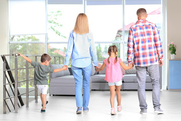 Happy family in room at new house