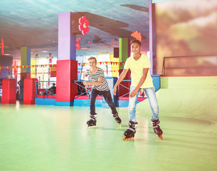 Teenage boys at roller skating rink
