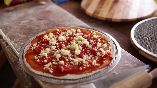 Italian pizza with cheese prepared for baking.
