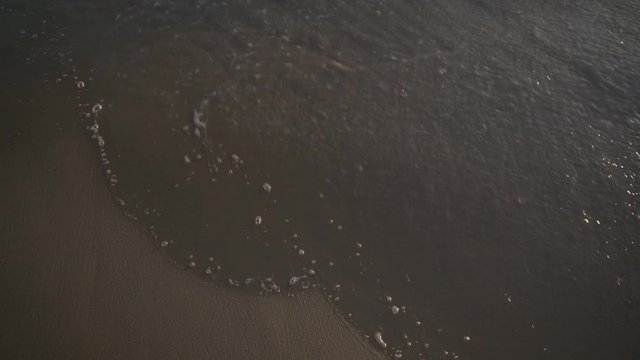 Wave in sunset. Close up