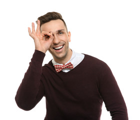 Fototapeta premium Handsome young man in bow tie on white background