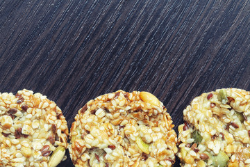 Homemade cornflakes and raisins cookies on old wooden table