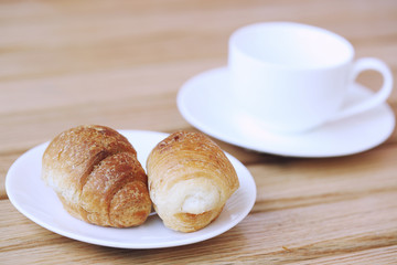 Homemade croissant . Delicious fresh croissant on wood table.