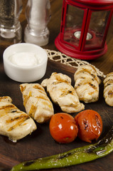 grilled chicken sauce with sauce and potato fries	