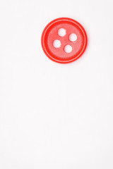 Sewing buttons on white background close up