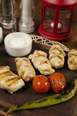 grilled chicken sauce with sauce and potato fries	