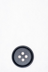 Sewing buttons on white background close up