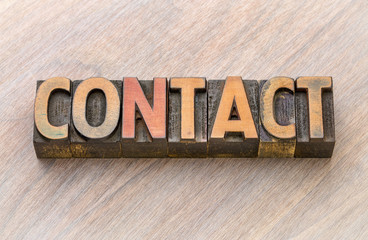 contact word abstract in wood type