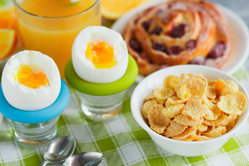 Soft boiled chicken egg, baking, muesli and orange juice