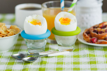 Soft boiled chicken egg, coffee, muesli and orange juice