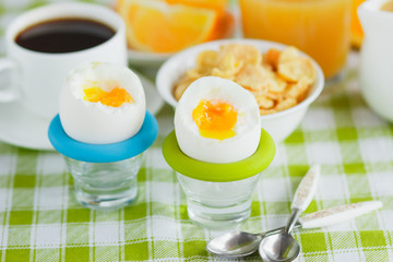 Soft boiled chicken egg, coffee and orange juice