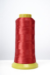 Spool of thread isolated on white background