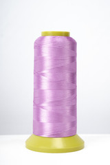 Spool of thread isolated on white background