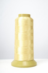 Spool of thread isolated on white background