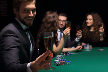 poker player with a glass of wine