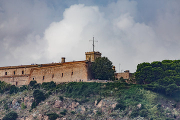 Fototapeta na wymiar Old Stone Fortress on Barcelona Hilltop