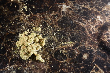 Cannabis with bong water pipe and hands o black  