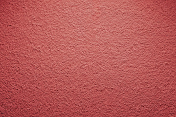 Red paint closeup wall pattern background.