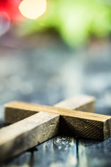 Traditional Christmas Holiday Ornaments and Christian Cross on a Dark Vintage Wood Background