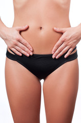 Fototapeta na wymiar Woman waist. Girl with perfect body shape, flat belly in underwear.