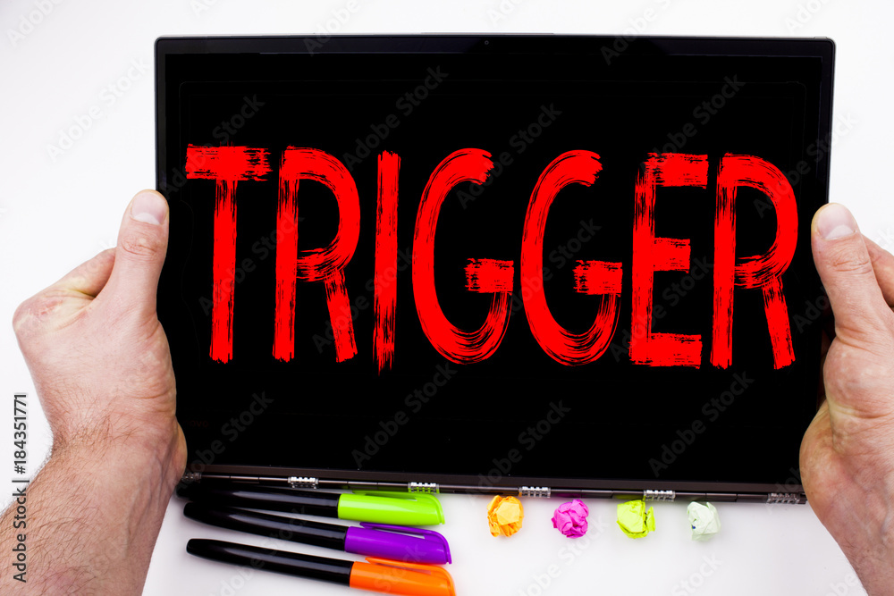 Fototapete trigger text written on tablet, computer in the office with marker, pen, stationery. business concep