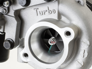 new turbocharged car engine Isolated on a light background