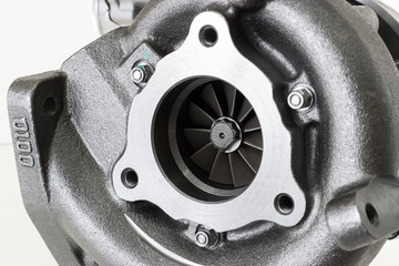 new turbocharged car engine Isolated on a light background