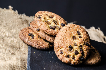 Raisin cookies on a dark background