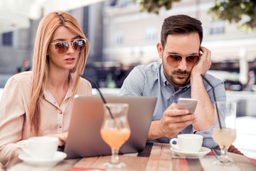 Young man and woman meeting at a coffee shop