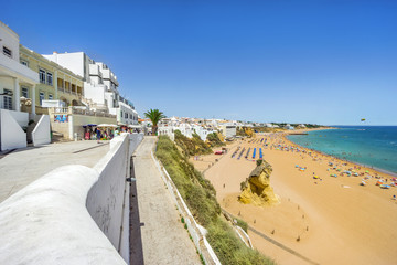 Cliffs, sandy beach and white architecture of Albufeira, Algarve, Portugal
