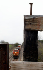 Train with spike on wooden bridge 