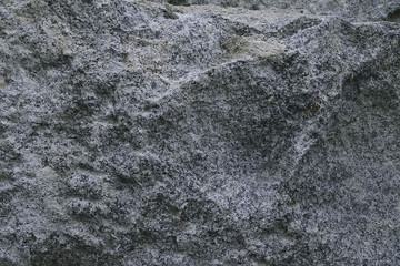 Dark grey granite rock background texture