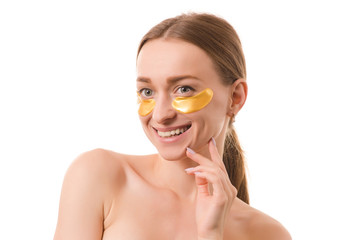 Beautiful young woman face patches under eyes