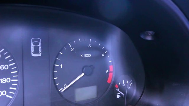Flickering hazard light button on car dashboard