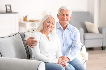 Mature couple in comfortable room