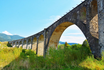 Fototapeta na wymiar Beautiful landscape with old railway bridge