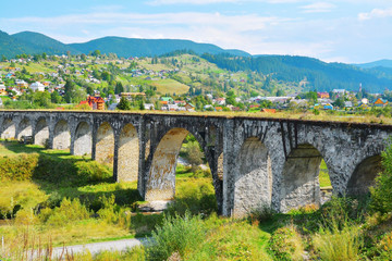 Fototapeta na wymiar Beautiful landscape with old railway bridge and countryside