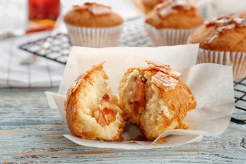 Tasty bacon muffin on table