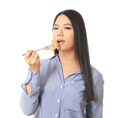 Beautiful Asian woman eating shrimp on white background