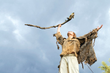 druid causes the rain raising his staff to the heavens