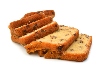 Sliced butter cake on white background
