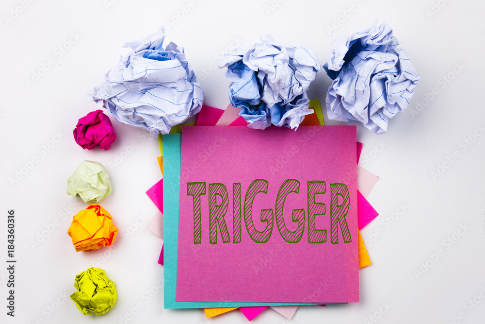 Fototapete Writing text showing Trigger written on sticky note in office with screw paper balls. Business concept for Stir Spark Loose or Unleash Idea on the white isolated background.
