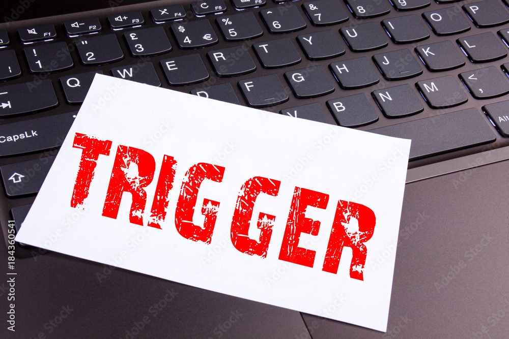 Fototapete writing trigger text made in the office close-up on laptop computer keyboard. business concept for s