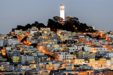 Coit Tower on Telegraph Hill as seen from Russian Hill at Dusk. San Francisco, California, USA.