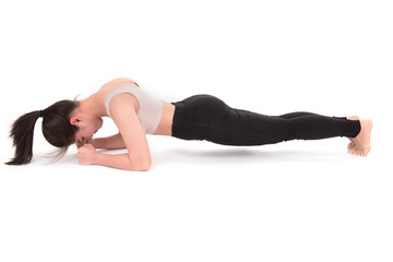 Portrait of woman stretching isolated on white background. Image of female doing plank static exercise  on white background. Health care sport girl concept.